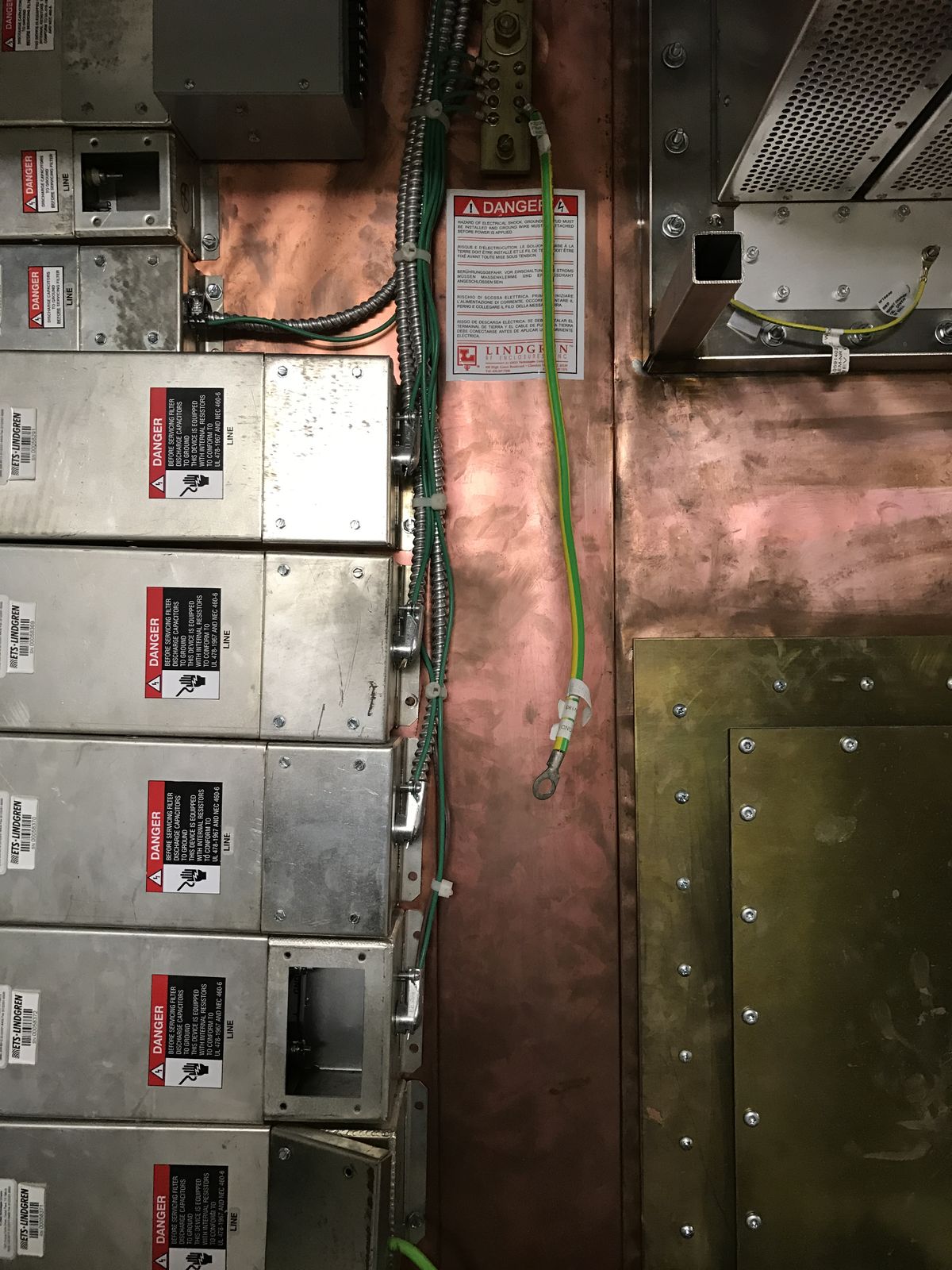 Shielded panels and grounding on the wall of an MRI room