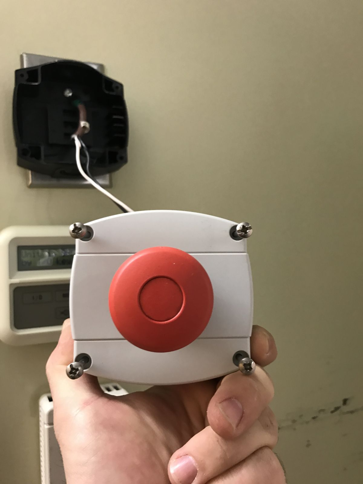 An emergency power-off button wired for an MRI room